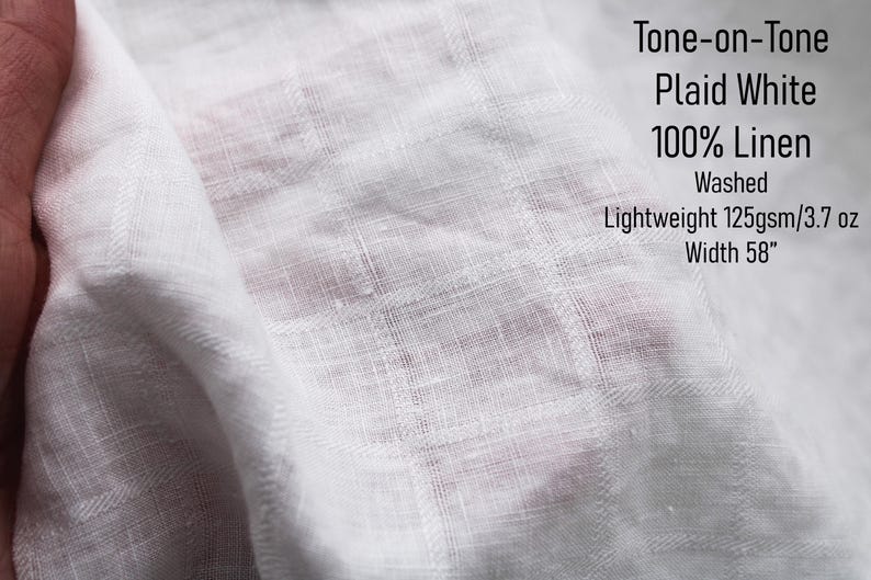 May include: White linen fabric featuring a tone-on-tone plaid pattern. The textile is washed, lightweight at 125gsm or 3.7 oz, and has a width of 58 inches. The text on the image reads: Tone-on-Tone Plaid White 100% Linen Washed Lightweight 125gsm/3.7 oz Width 58".