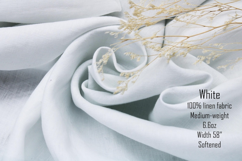 May include: White 100% linen fabric with a medium-weight of 6.6oz and a width of 58 inches. The softened fabric is draped in folds and accented with a sprig of dried flowers. The text on the image reads: White, 100% linen fabric, Medium-weight, 6.6oz, Width 58", Softened.