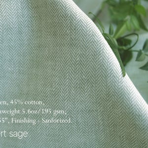 May include: Close-up of a fabric with a herringbone pattern in desert sage color. The fabric is 55% linen and 45% cotton, mediumweight 5.6 oz/195 gsm, and 55 inches wide. The finishing is sanforized. The text "Desert sage" is visible.