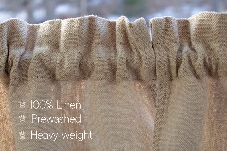 May include: Close-up of a beige linen curtain with a textured weave. The curtain is pre-washed and heavy weight. The text "100% Linen", "Prewashed", and "Heavy weight" is printed on the curtain.