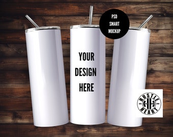 May include: Three white stainless steel tumblers with lids and straws. The middle tumbler has the text "YOUR DESIGN HERE" printed on it. The tumbler on the right has a black and white logo that says "Hustle Heart" printed on it.