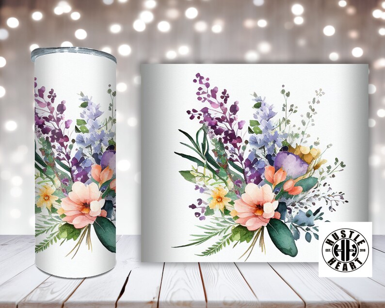 May include: A white tumbler with a watercolor floral design featuring purple, blue, yellow, and pink flowers. The tumbler has a white background and the floral design is centered on the tumbler.