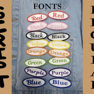 May include: A light blue denim jacket displays embroidered patches in various colors, each with a different font. The patches are oval-shaped with white borders and feature the words "Red", "Pink", "Black", "Yellow", "Orange", "Green", "Purple", and "Blue". The words "FONTS", "SCRIPT", and "REGULAR" are also visible.