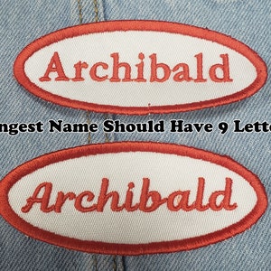 May include: Two embroidered patches with the name "Archibald" in red script on a white oval. The patches have a red border and are set against a denim background. The text "Longest Name Should Have 9 Letters" is also visible.
