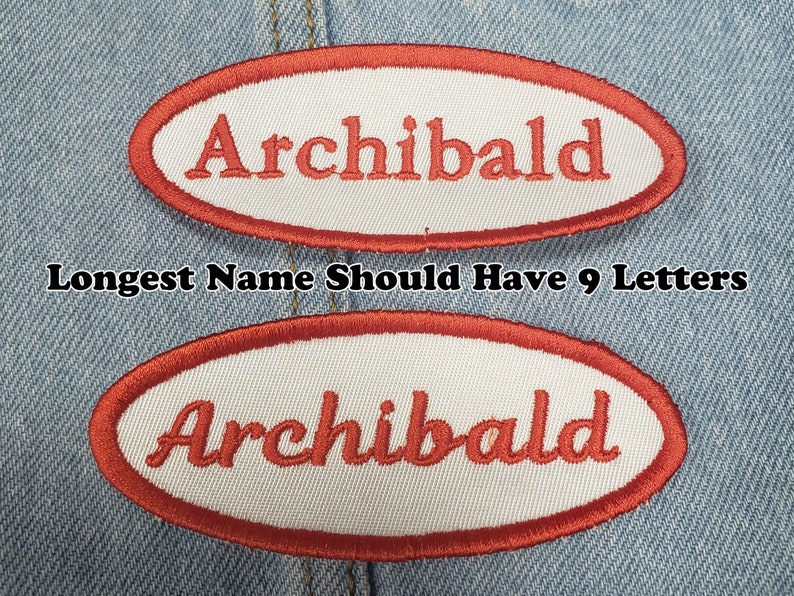 May include: Two embroidered patches with the name "Archibald" in red script on a white oval. The patches have a red border and are set against a denim background. The text "Longest Name Should Have 9 Letters" is also visible.
