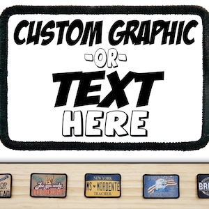 May include: White rectangular patch with black border and text "CUSTOM GRAPHIC OR TEXT HERE" in a bold, comic book style font.