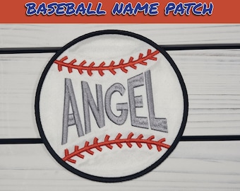 May include: White baseball-shaped patch with red stitching and a gray embroidered name "ANGEL" on a white background.