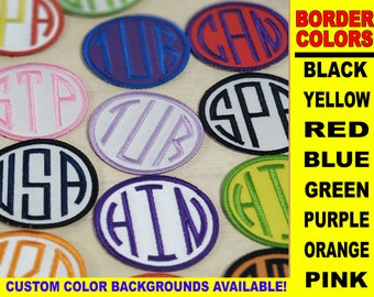 May include: Assortment of round fabric patches with different colored borders and white backgrounds. The patches feature various initials and words, including "USA", "SP", "TUR", "HIN", "CAD", and "STP". The text "BORDER COLORS" is displayed in a yellow box with black text, followed by a list of colors: black, yellow, red, blue, green, purple, orange, and pink.