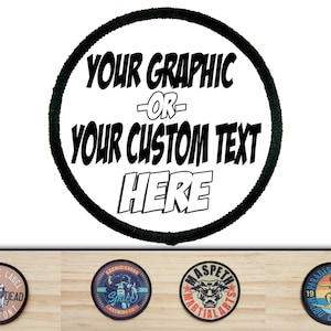 May include: A white round patch with a black border. The text "YOUR GRAPHIC OR YOUR CUSTOM TEXT HERE" is printed in black with a comic book style font.