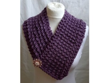 Beautiful, chunky, hand knitted, lace stitch scarf with exuisite brooch detail. Neck warmer. Fashion scarf.