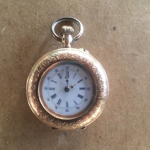 Ladies gold pocket watch