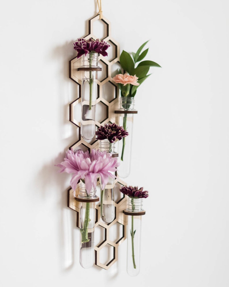 Hanging wall bud vase with pink and magenta and orange flowers