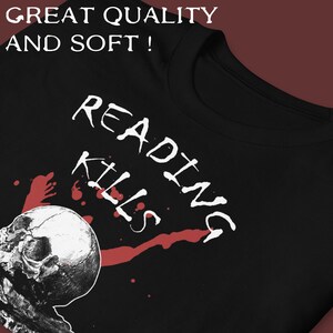 May include: Black t-shirt with a white graphic of a skull and the text "Reading Kills". The skull is surrounded by red splatters.