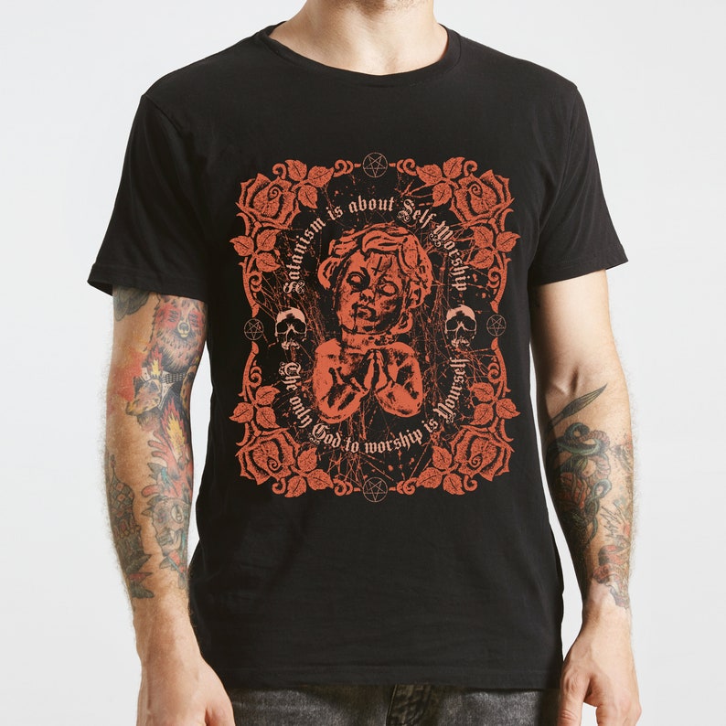 May include: Black t-shirt with a red graphic design featuring a stylized image of a person with the text "Satanism is about Self Worship. The only God to worship is Yourself."