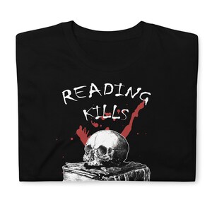 May include: Black t-shirt with white text that reads "READING KILLS" and a skull on top of a book with red blood splatters.