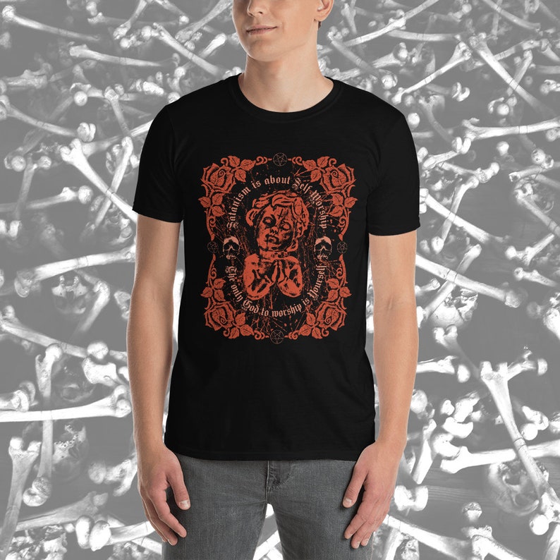 May include: Black t-shirt with a red graphic design featuring a stylized image of a person with a crown of thorns and the text "Satanism is about Self-Worship. The only God to worship is You."