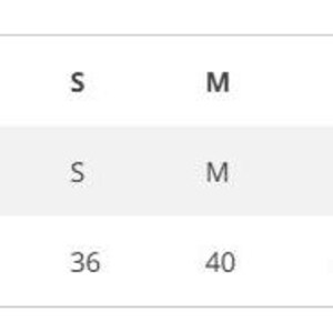 May include: Size chart showing chest measurements in inches for sizes XS through XXL.