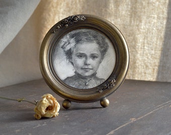 Framed round child portrait | original work | graphite on paper | black and white