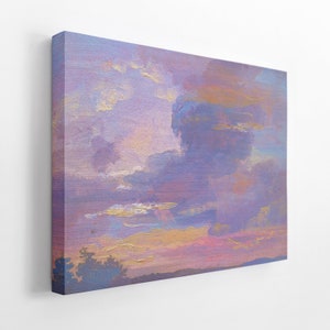 May include: A canvas print featuring an impressionistic landscape painting. The artwork depicts a sunset or sunrise with a sky filled with lavender, gold, and blue clouds. The painting has a textured appearance, suggesting the use of thick brushstrokes.