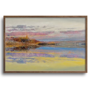 May include: A framed landscape painting depicts a serene scene with a body of water reflecting a colorful sky. The artwork features a palette of pink, yellow, blue, and gray hues, with a wooden frame.