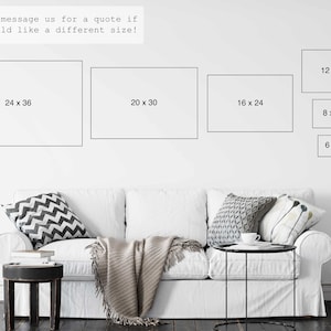 May include: A white wall displays framed art prints in various sizes: 24x36, 20x30, 16x24, 12x18, 8x12, and 6x9 inches. The text above reads, "Please message us for a quote if you would like a different size!" A white sofa with decorative pillows is in the foreground.