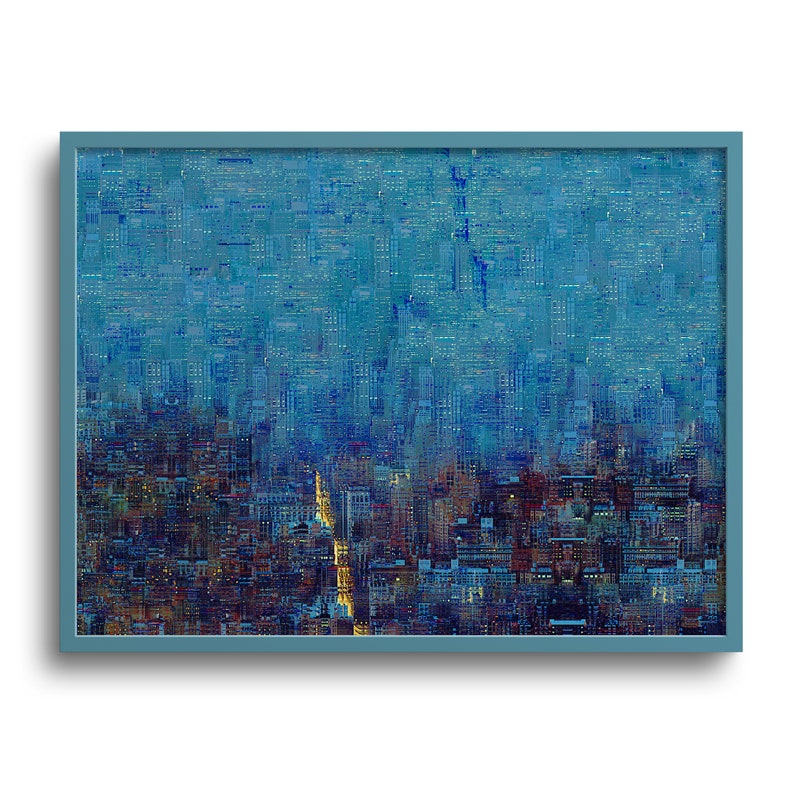 May include: Abstract cityscape art print in a light blue frame. The artwork depicts a dense urban landscape with buildings in shades of blue, brown, and gold. The overall theme is a nighttime city scene.