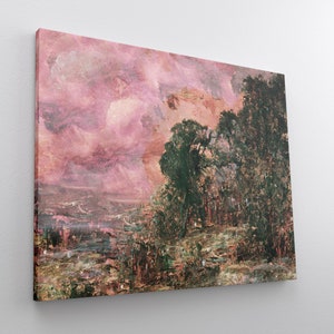 May include: A canvas print of an impressionistic landscape painting. The artwork features a pink and peach-colored sky with dark green trees on the right side. The foreground shows a mix of green and brown tones, suggesting a natural setting.