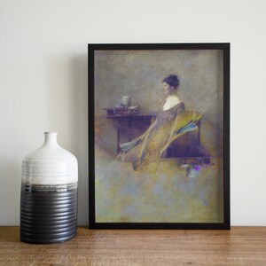 May include: Framed art print depicting a woman in a flowing gown, holding a fan. The artwork uses muted gold, purple, and blue tones. A decorative vase with black and white sections is to the left of the framed print.
