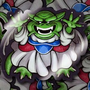 May include: A green, cartoon-style monster with a white, red, and blue outfit. The monster has a wide, toothy grin and is depicted in a sticker format.