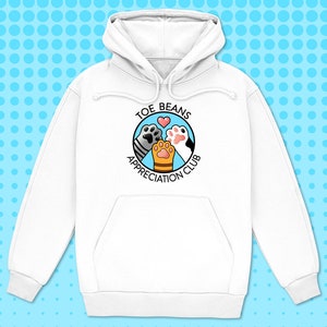 May include: White hoodie with a graphic of three cat paws in a circle with the text "Toe Beans Appreciation Club".