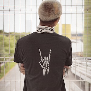 Unleash Your Inner Rock Legend with the Skeletal Rocker Hand Tee