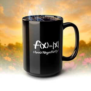 May include: A black coffee mug with the mathematical equation f(x) = |x| and the text "Avoid Negativity" in white. The mug is filled with coffee, and steam rises from the top. The background is a blurred image of a sunset.
