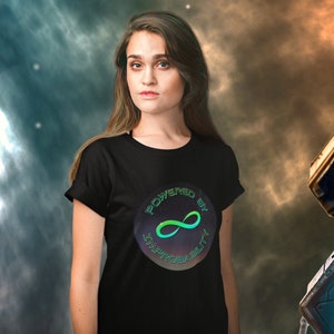 May include: A black t-shirt with a circular graphic featuring a green infinity symbol and the text "Powered by Improbability".