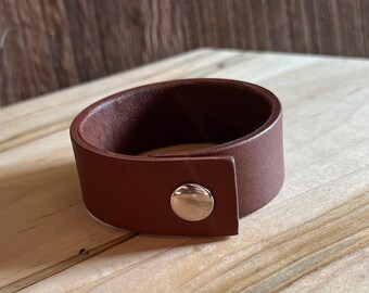Women’s Brown Leather Snap Cuff with full leather lining. Handcut and handmade in the USA.