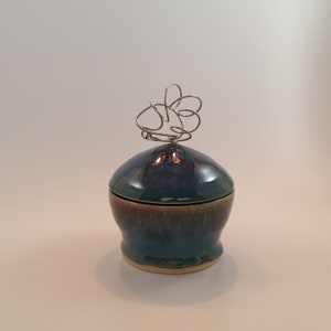 Handmade pottery lidded bowl with wire finial