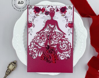 May include: A red and white laser cut invitation with a floral design. The invitation features a silhouette of a woman in a gown. The text on the invitation reads "Mr. & Mrs. Cordially Invite You To Celebrate The Quinceanera Of Aaliyah"
