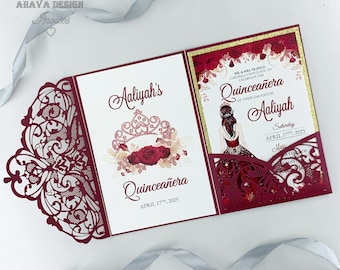 May include: Burgundy laser cut invitation with a white insert. The invitation features a floral design with a crown and the text "Aaliyah's Quinceañera April 17th, 2025". The insert has a gold glitter background and the text "Mr. & Mrs. Franco Cordially Invite You To Celebrate The Quinceañera Of Their Daughter Aaliyah Saturday April 17th, 2025 Mass"