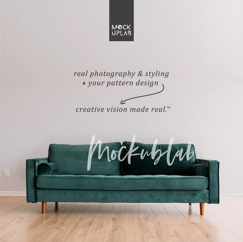 May include: A teal velvet sofa with wooden legs in a room with a white wall. The text "Mockublab" is written in black on the wall, along with the text "real photography & styling + your pattern design creative vision made real.&trade;"