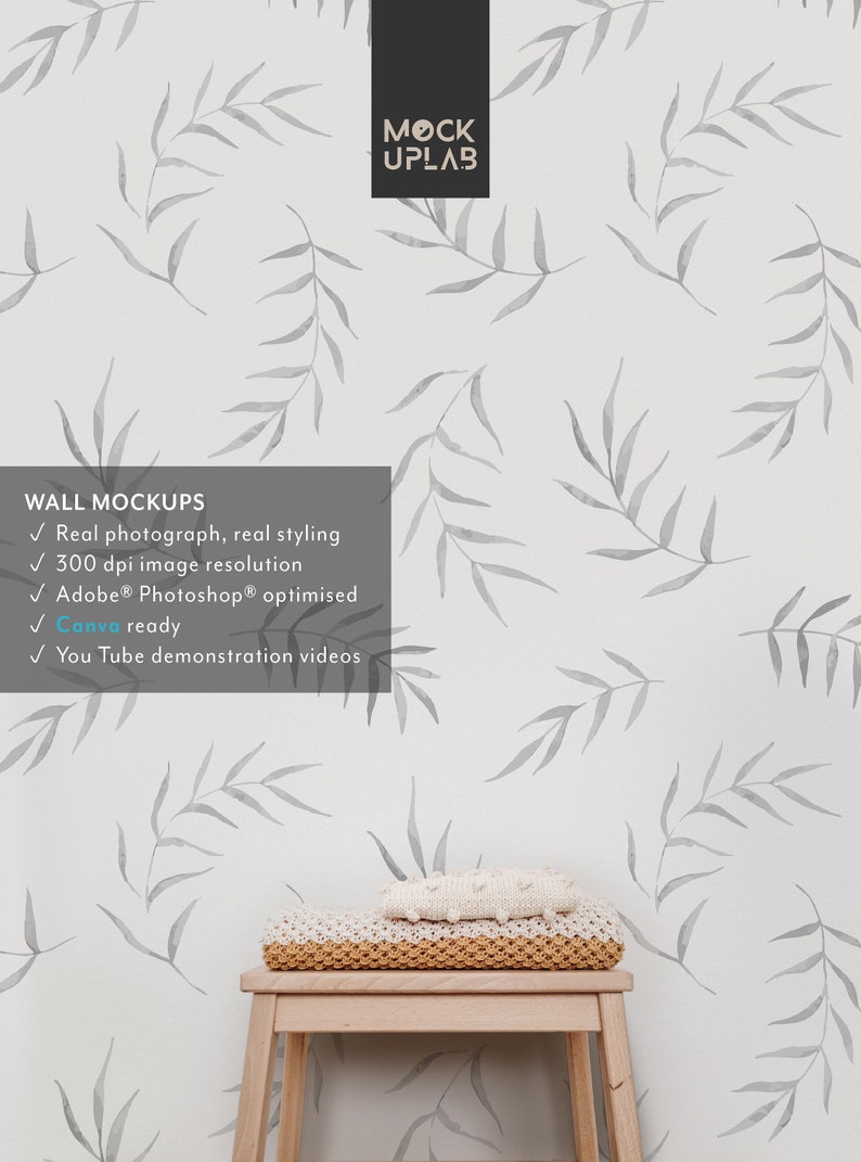 May include: A white wall with a gray watercolor leaf pattern. A wooden stool with a knitted throw blanket on top. The text "WALL MOCKUPS" is on the left side of the image. The text "Real photograph, real styling" is below the text "WALL MOCKUPS". The text "300 dpi image resolution" is below the text "Real photograph, real styling". The text "Adobe&reg; Photoshop&reg; optimised" is below the text "300 dpi image resolution". The text "Canva ready" is below the text "Adobe&reg; Photoshop&reg; optimised". The text "You Tube demonstration videos" is below the text "Canva ready". The text "MOCK UPLAB" is in the upper right corner of the image.