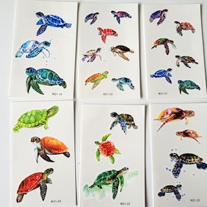 May include: Ten sheets of temporary tattoos featuring colorful sea turtle designs. Each sheet has a different design and includes the text "W21-19", "W21-20", "W21-21", "W21-22", "W21-23", and "W21-24".