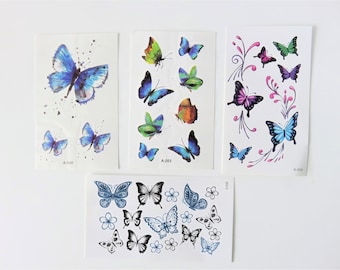 May include: Four sheets of temporary tattoos featuring colorful butterfly designs. The sheets are labeled A-048, A-203, X-314, and A-202.
