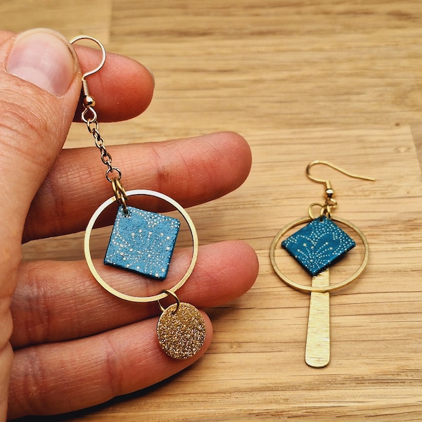 Different mismatched asymmetrical golden earrings with duck blue Japanese paper