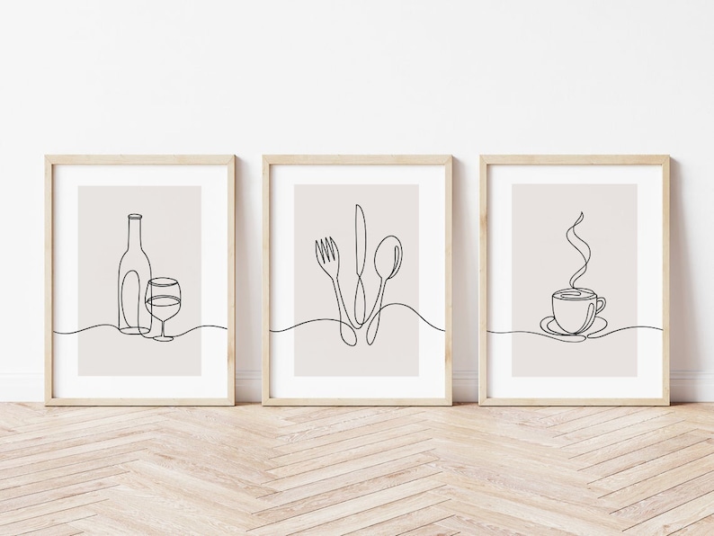 May include: Three minimalist line art prints in wooden frames. The prints depict a wine bottle and glass, a fork, knife, and spoon, and a steaming cup of coffee.