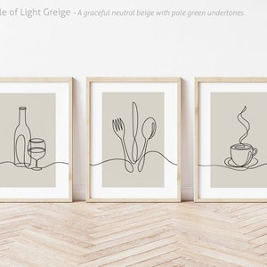 May include: Three minimalist line art prints in wooden frames. The prints feature a wine bottle and glass, a fork, knife, and spoon, and a steaming cup of coffee.