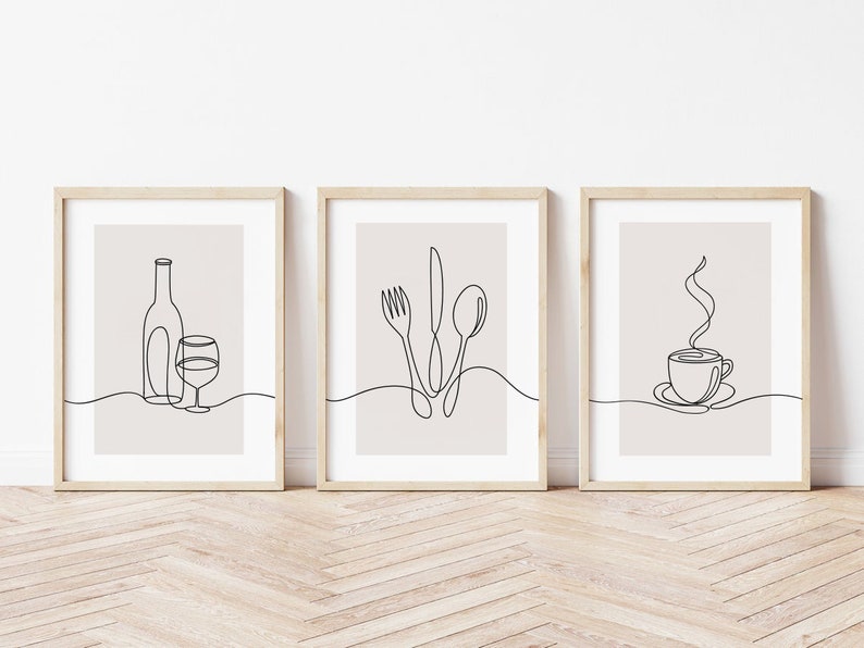 May include: Three minimalist line art prints in wooden frames. The prints depict a wine bottle and glass, a fork, knife, and spoon, and a steaming cup of coffee.