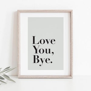 May include: A framed print with a light green background and the text "Love You, Bye." in black.
