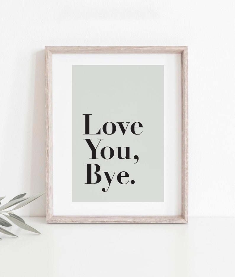 May include: A framed print with a light green background and the text "Love You, Bye." in black.