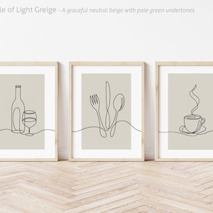 May include: Three minimalist line art prints in wooden frames. The prints feature a wine bottle and glass, a fork, knife, and spoon, and a steaming cup of coffee.