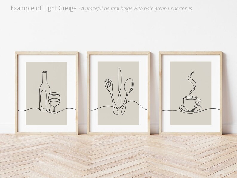 May include: Three minimalist line art prints in wooden frames. The prints feature a wine bottle and glass, a fork, knife, and spoon, and a steaming cup of coffee.