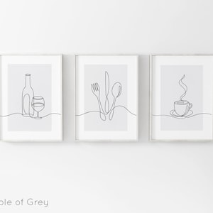 May include: Three framed prints with minimalist line drawings of a wine bottle and glass, a fork, knife, and spoon, and a steaming cup of coffee. The prints are on a white background.